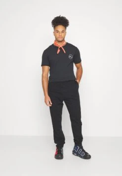 YOURTURN Unisex - Trainingsbroek - Black -Yourturn Verkoopwinkel 4726d7ee4d5647f8a5f5c8ffe5554ff0