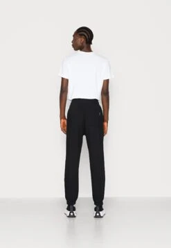 YOURTURN Unisex - Trainingsbroek - Black -Yourturn Verkoopwinkel 93239351f3ae4382bd2bf96cade29d39