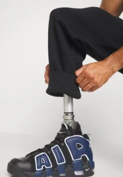 YOURTURN Unisex - Trainingsbroek - Black -Yourturn Verkoopwinkel 96890d6b49c24a0ca097867b183abe35